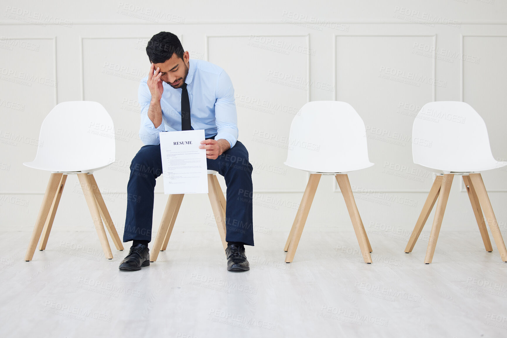 Buy stock photo Full length of asian businessman waiting for an interview. One young stressed applicant sitting alone. Sad ethnic professional holding resume in line for job opening, vacancy and opportunity in office