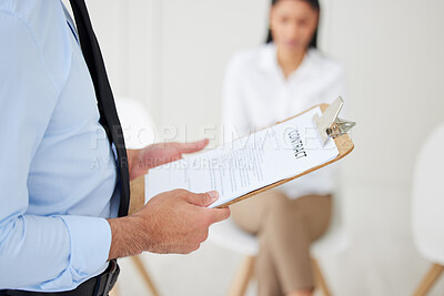 Closeup of unknown mixed race hiring manager using clipboard during interview. Hispanic businessman calling candidate for job opening, vacancy, office opportunity. Confident professional hr employer