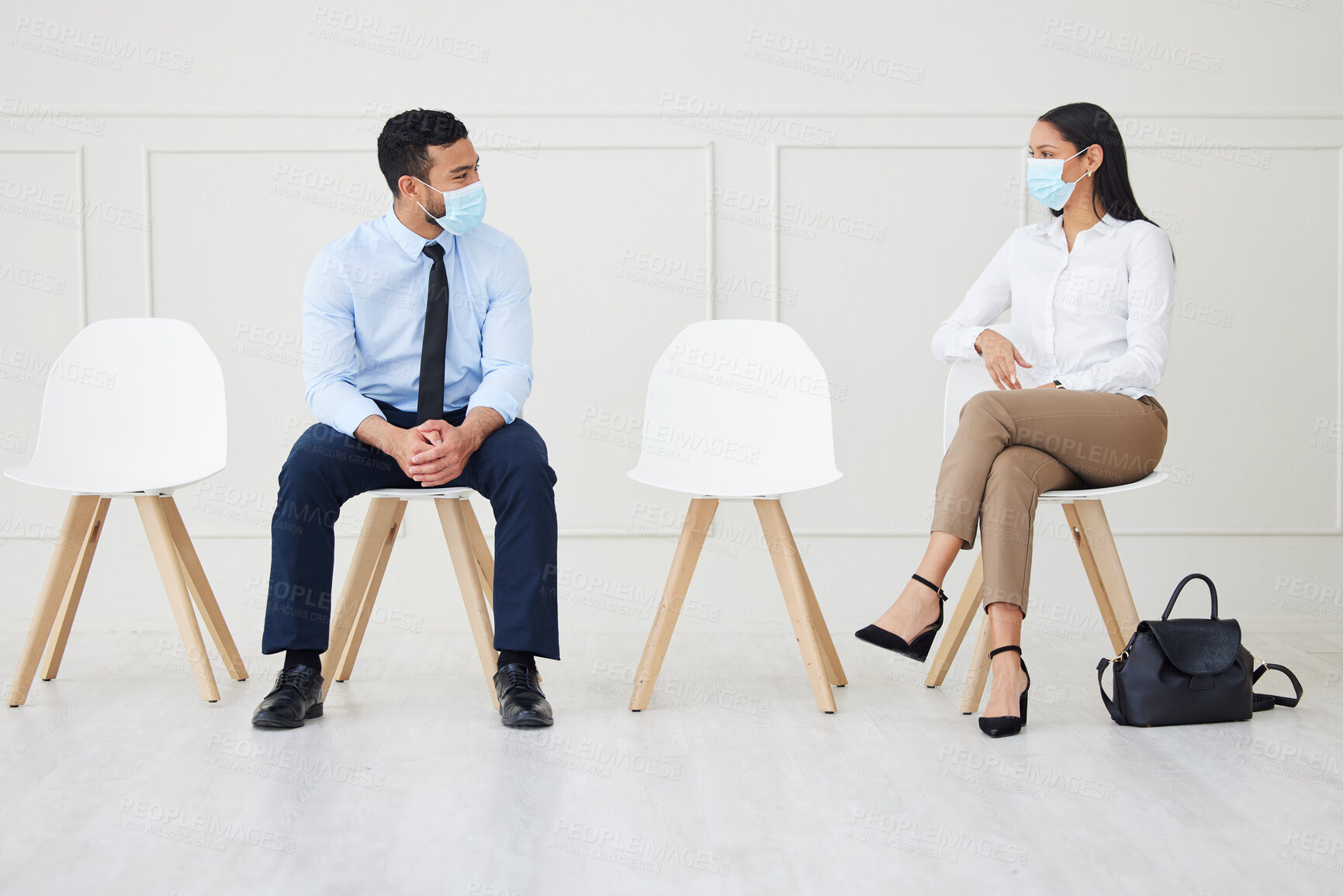 Buy stock photo Face mask, chair and business people waiting for interview, job vacancy and opportunity in office. Corporate, recruitment and man and woman talking, speaking and in conversation for hiring in covid