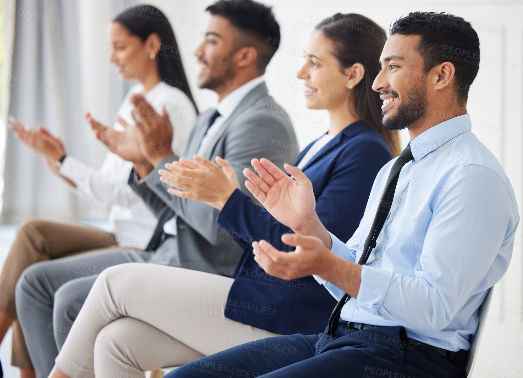 Buy stock photo Group of diverse businesspeople clapping and celebrating success during interview. Team of applicants together, attending office seminar. Candidates in line for job opening, vacancy and opportunity