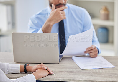 Buy stock photo Unknown mixed race hiring manger in interview with businessman. CEO reading resume and cv of candidate for job opening, vacancy, office opportunity. Hr boss thinking and using laptop for applicant