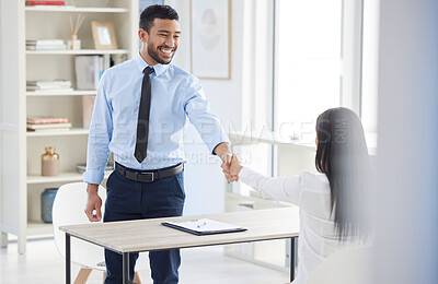 Buy stock photo Two mixed race businesspeople in handshake after signing contract in interview. Asian applicant meeting CEO and hiring manger. Candidate hired for job opening, vacancy, office opportunity, promotion