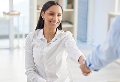 Two mixed race businesspeople in handshake after signing contract in interview. Hispanic applicant meeting CEO, hiring manger. Candidate hired for job opening, vacancy, office opportunity, promotion