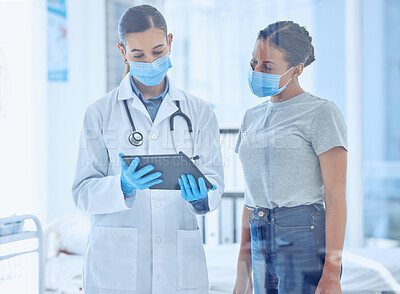 Buy stock photo Doctor showing a patient covid research results. Patient in checkup for corona virus test results. Doctor using a digital tablet in a consult with patient. Patient talking to doctor in checkup