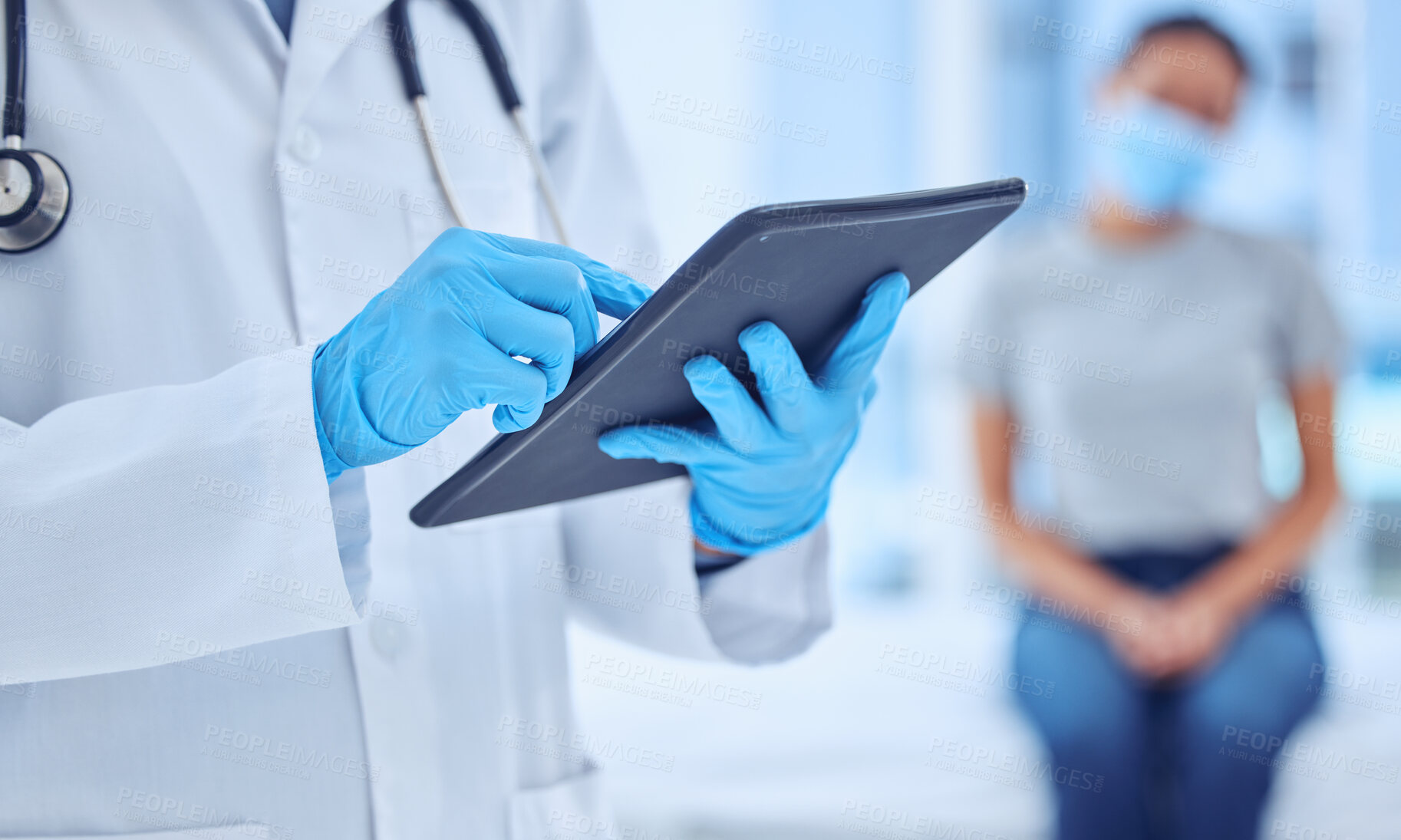 Buy stock photo Hands of doctor using a digital tablet in checkup. Physician checking patient covid test results on wireless device. Closeup on hands of gp using online digital device in checkup