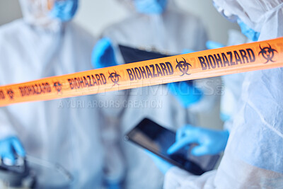 Buy stock photo Closeup on biohazard quarantine tape. Hands of scientist using a digital tablet behind covid barrier. Medical professional working in a biohazard crime scene. Doctors working behind caution tape
