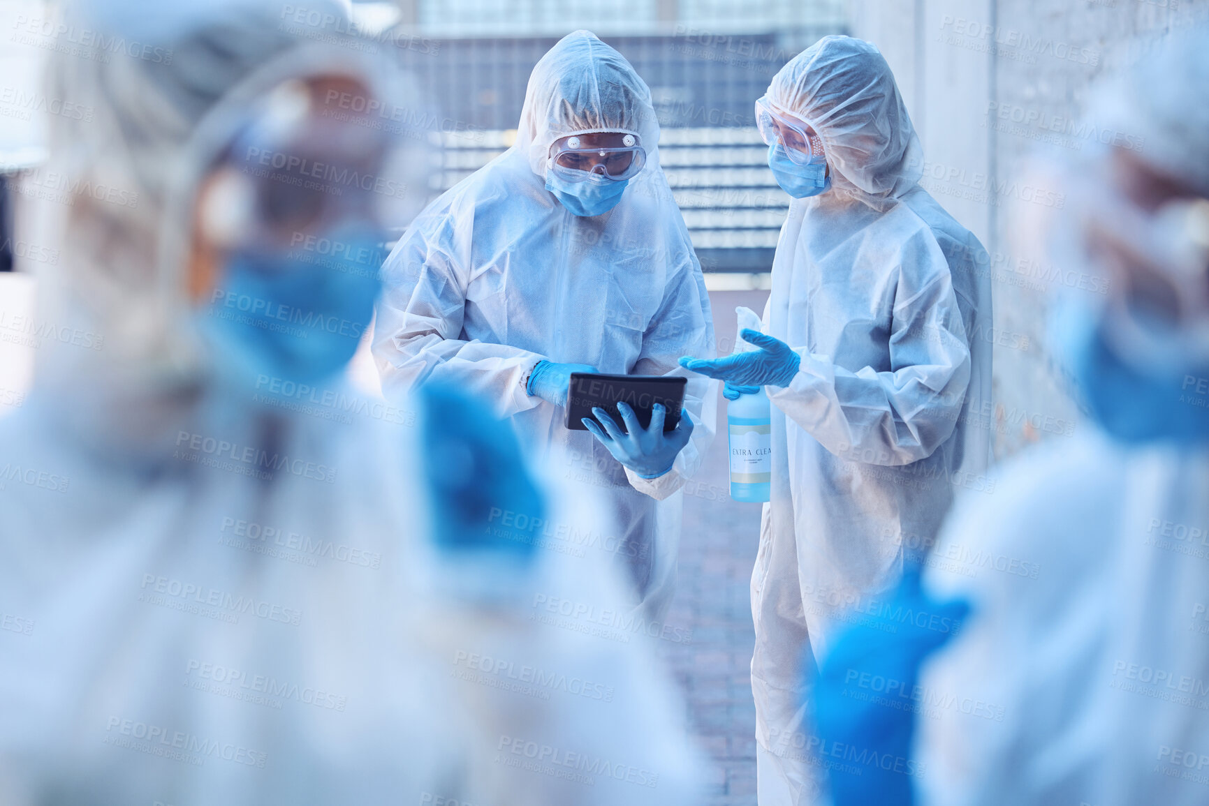 Buy stock photo Csi cleaning team using digital tablet. Biohazard colleagues talking about pandemic research outside. Science coworkers talking about corona virus report. Biologists using wireless device outisde