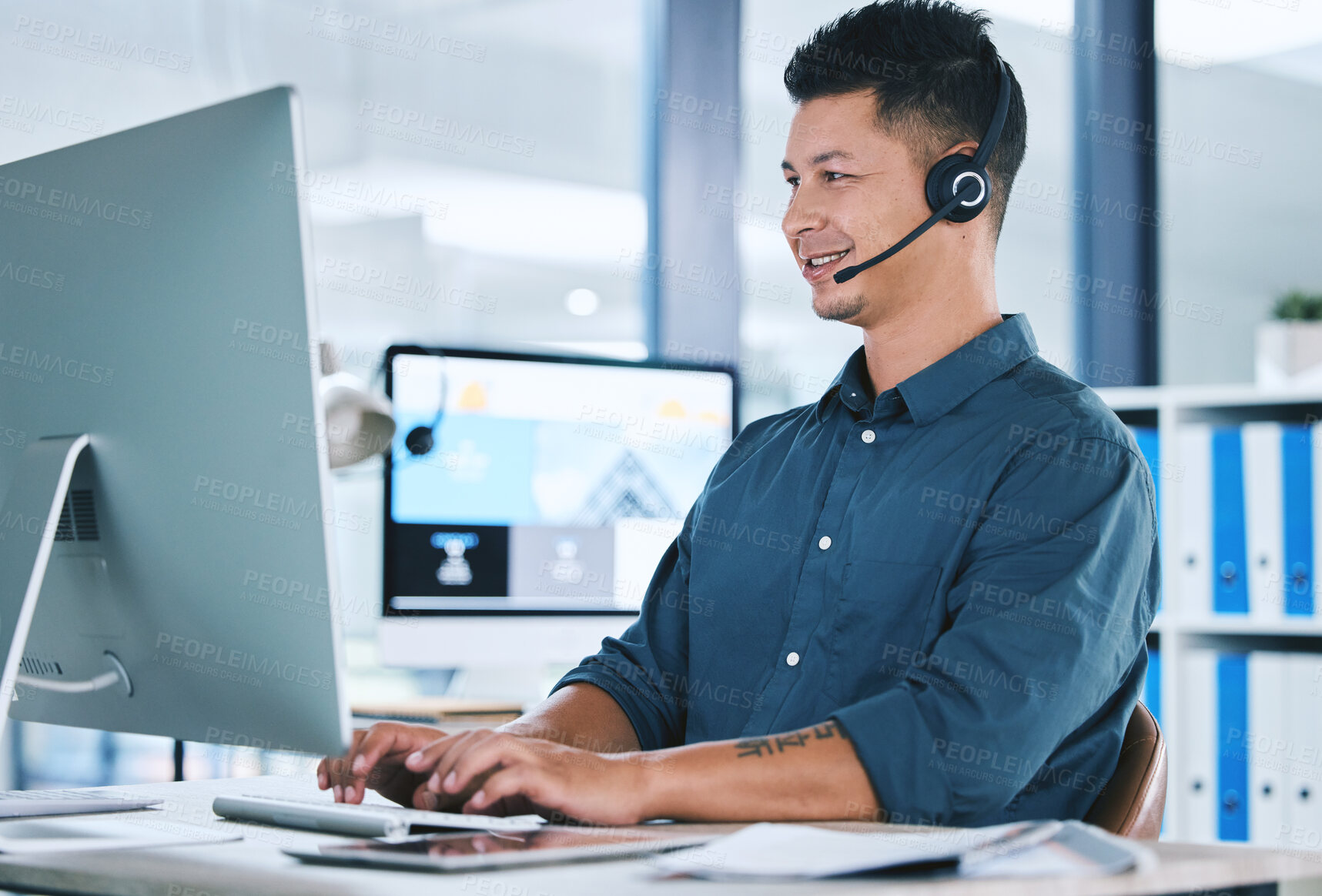 Buy stock photo Call center, customer service and a man typing on computer with a headset for contact us communication. Crm, telemarketing and sales or technical support agent or consultant person at pc for advice