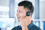 One happy hispanic call centre telemarketing agent talking on a headset while working in an office. Confident friendly male consultant operating a helpdesk for customer service and sales support