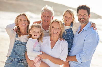 Buy stock photo Portrait of a senior caucasian couple at the beach with their children and grandchildren. Caucasian family relaxing on the beach having fun and bonding