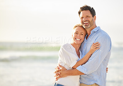 Buy stock photo Happy couple hug on beach, love and travel with anniversary vacation, tourism and mockup space. Happiness, trust and commitment with man and woman on tropical holiday, ocean and affection outdoor