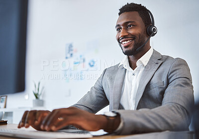 Buy stock photo One happy young african american call centre telemarketing agent talking on a headset while working on computer in an office. Confident friendly male consultant operating helpdesk for customer service and sales support