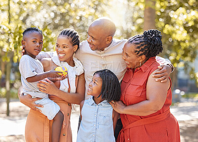 Buy stock photo Portrait happy african american family of five spending quality time together in the park during summer. Grandparents, mother and children bonding together outside. An outing with the children