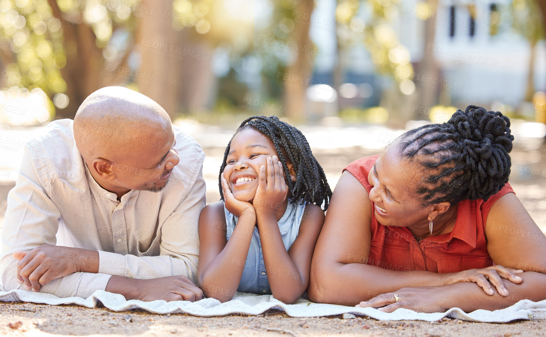 Buy stock photo Happy family, grandparents or funny child in park to relax in nature on summer holiday together. Mature African dad, funny black woman or girl loves bonding with grandmother or grandfather on picnic