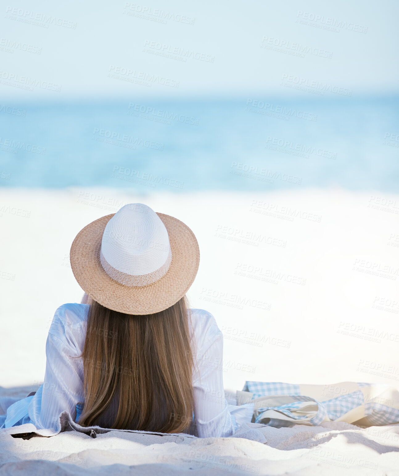 Buy stock photo Woman, back and relax at beach with space, mockup and sky background on summer vacation in sunshine. Girl, lying and waves with travel, holiday and calm in sun, sea mockup and sand in Rio de Janeiro