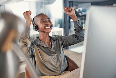 Buy stock photo One happy young african american call centre telemarketing agent cheering with joy while working in an office. Excited and ambitious female consultant celebrating successful sales targets and winning victory