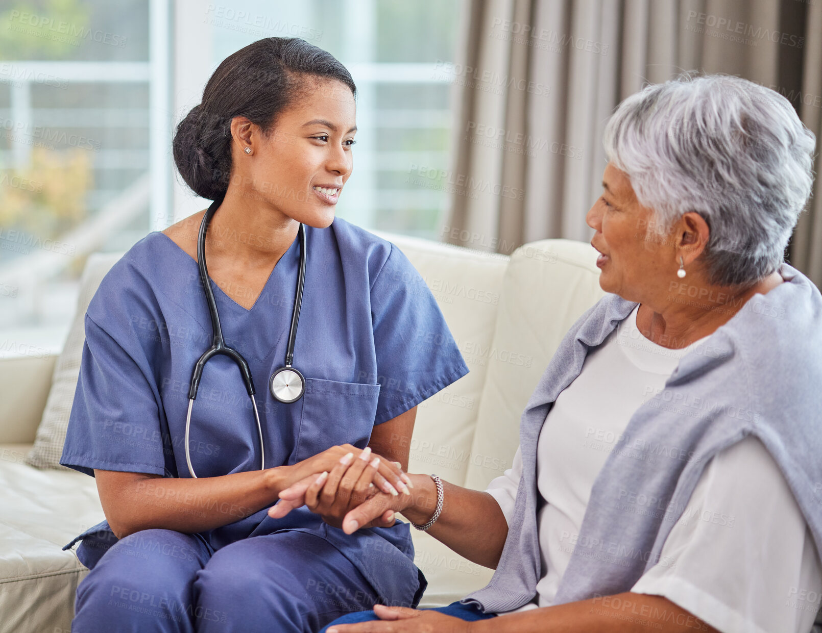 Buy stock photo Happy, nurse and senior woman holding hands in nursing home, talking and comfort on sofa. Support, caregiver and elderly female person in retirement with trust in medical professional for healthcare.