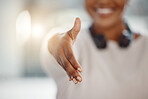 Closeup of one african american businesswoman extending hand forward to greet and welcome with handshake. Networking and meeting for interview to agree on deal or offer. Collaborating on negotiation for job promotion