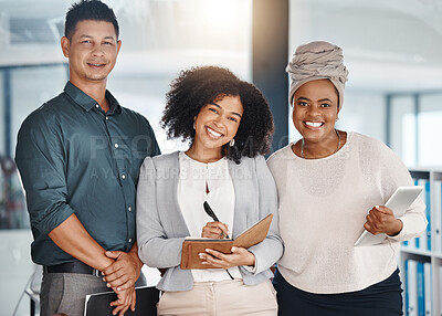 Portrait of a group of confident diverse businesspeople standing in an office. Happy smiling colleagues motivated and dedicated to success. Cheerful and ambitious team working closely together