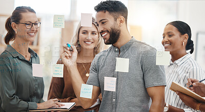 Buy stock photo Meeting, planning and a business man writing on glass with his team for strategy or brainstorming in the office. Collaboration, coaching and leadership with a male employee teaching his colleagues