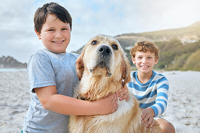 Buy stock photo Portrait of two cute little boys playing with their pet golden retriever at the beach. Cheerful kids having fun while rubbing loyal furry brown dog outdoors