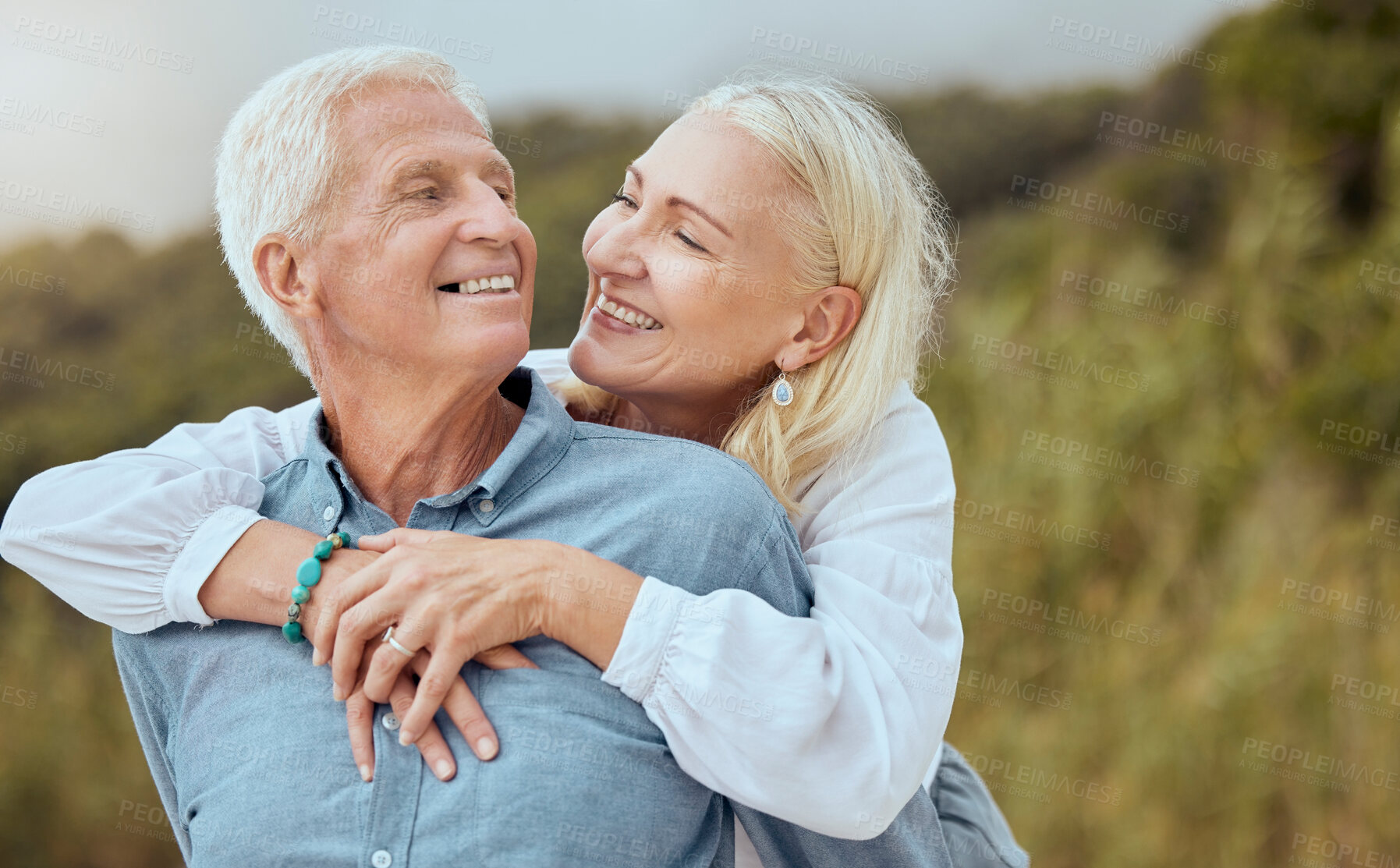 Buy stock photo Love, happy and senior couple hug, relax or enjoy quality time together in nature countryside for calm, freedom or peace. Happy, smile or bonding elderly retirement man and woman on fun romantic date
