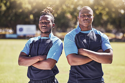 Buy stock photo Portrait two young african american rugby players standing with their arms crossed outside on the field. Black men looking confident and ready for the match. Athletic sportsmen focused on the game