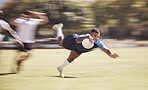 Mixed race rugby player diving to score a try during a rugby match outside on a field. Hispanic male athlete making a dive to try and win the game for his team. Young man reaching out for the try line