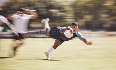 Buy stock photo Mixed race rugby player diving to score a try during a rugby match outside on a field. Hispanic male athlete making a dive to try and win the game for his team. Young man reaching out for the try line