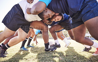 Buy stock photo Below two opponent rugby teams contesting a scrum during a match outside on a field. Rugby players battling and fighting to win the ball while competing for possession in a game. Strength and power