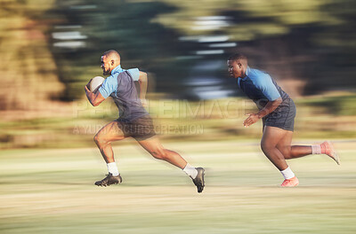 Buy stock photo Mixed race rugby player running away from an opponent while attempting to score a try during a rugby match outside on a field. Hispanic male athlete making a play to try and win the game for his team