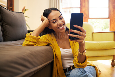 Buy stock photo Smile, relax and a woman with a phone for an app, communication and social media. Happy, funny and a girl reading a text message, chat or notification on a mobile in the living room of a house