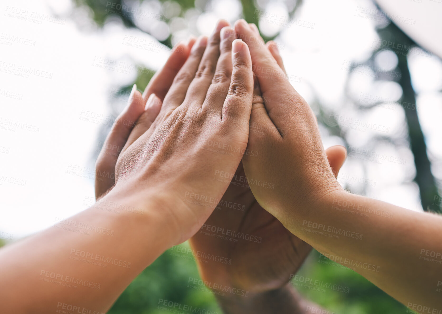 Buy stock photo High fives of a diverse group of people. Closeup of multiethnic hands touching in the air. Group give high five as a concept to celebrate