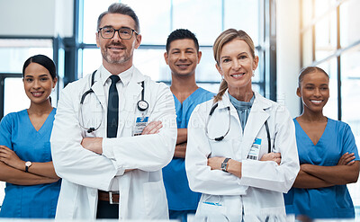 Buy stock photo Doctors, nurses and team portrait in hospital, clinic or medical office. Teamwork, diversity and healthcare professionals standing together with arms crossed in confidence, collaboration or support.
