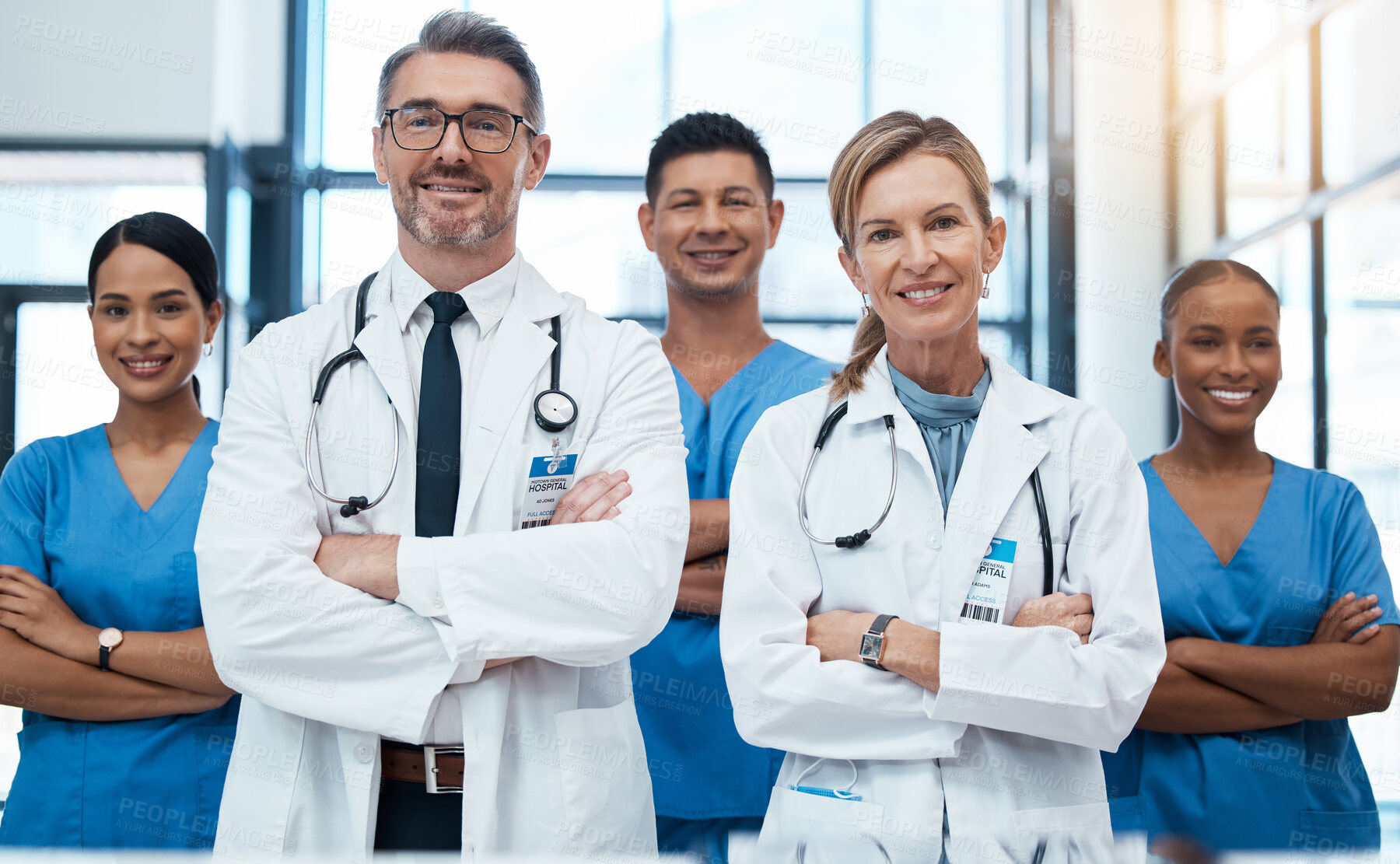 Buy stock photo Doctors, nurses and team portrait in hospital, clinic or medical office. Teamwork, diversity and healthcare professionals standing together with arms crossed in confidence, collaboration or support.
