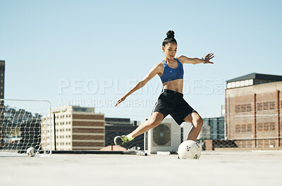 Buy stock photo Soccer player, woman and soccer ball kick in fitness, training or exercise on Portugal city building rooftop. Football player, sports person and athlete in energy workout for health or wellness goals