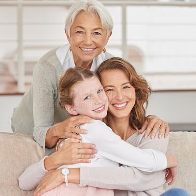 Buy stock photo Portrait of a grandmother relaxing with her daughter and mother. Little girl bonding with her parent and grandparent in the living room at home. Three generations spending time together