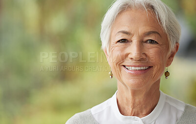 Buy stock photo Smiling senior woman with copy space on the side. Portrait of a beautiful confident elderly female with grey hair. Face of a happy pensioner enjoying retirement. Relaxed wise lady feeling optimistic