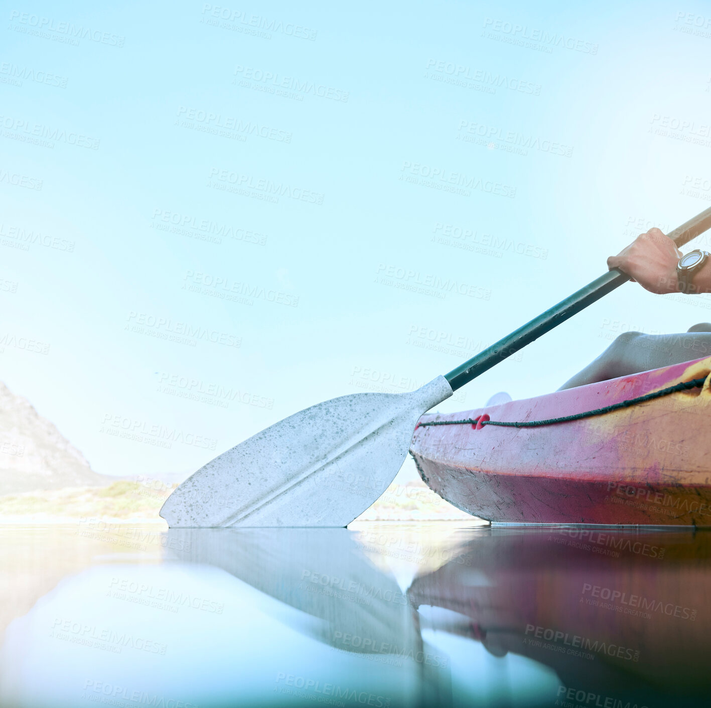 Buy stock photo Closeup of kayak oar paddle rowing on calm water. Female hands kayaking on a lake during summer break. Woman outside in nature enjoying water activity. Training and practicing for a kayak race 