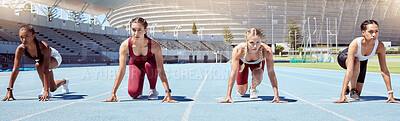 Buy stock photo Group of determined female athletes in starting position to begin a sprint or running race on a sports track in a stadium. Focused and diverse women ready to compete in track and field olympic event