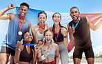 Portrait diverse group of olympic athletes holding winners' medals and a French flag. Happy and proud champions of France. Winning a medal for your country is an amazing achievement for a sportsperson