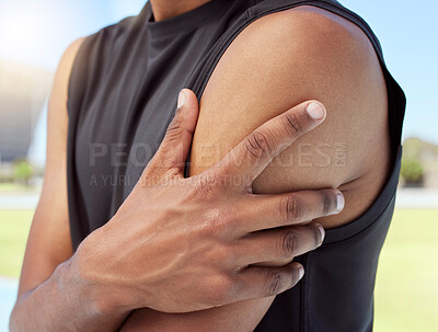 Buy stock photo Closeup of african american sportsman suffering from shoulder pain while training. Zoomed in on unknown black man holding and rubbing sore arm with. Overworking muscles causing tension