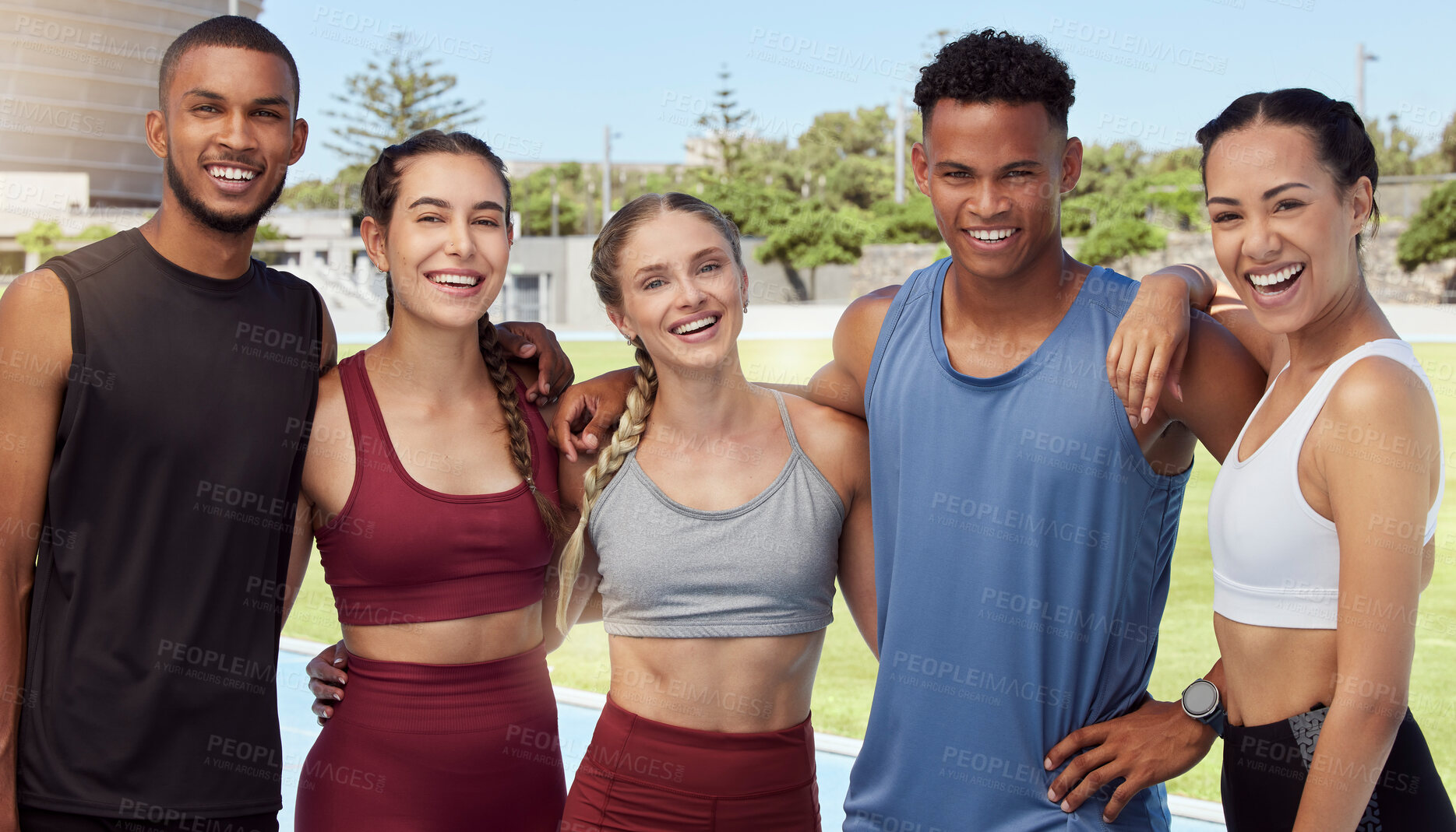 Buy stock photo Portrait of diverse group of athletes standing together and smiling after practice. Young, happy, fit, active sports team bonding in training sports centre. Athletic people after exercise and workout