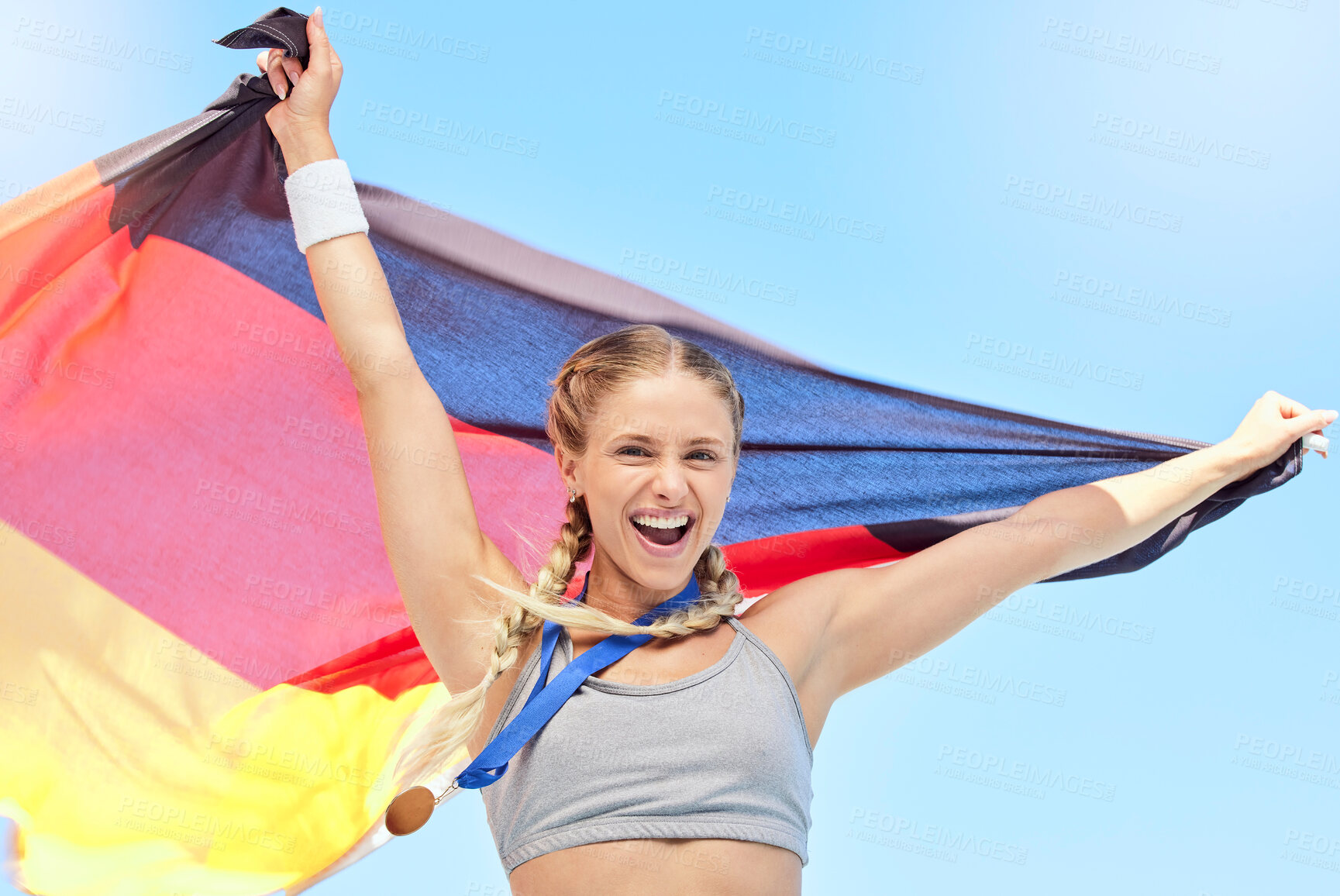 Buy stock photo Portrait of winning athlete cheering, holding German flag after competing in sports. Smiling fit active sporty motivated woman. Celebrating achieving a gold medal in olympic sport with national pride