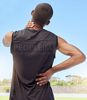 Buy stock photo Injured athlete with sore neck and back muscles from behind. Uncomfortable athlete suffering from pain from tight and inflamed joints. Body strain and discomfort caused by overexertion from exercise