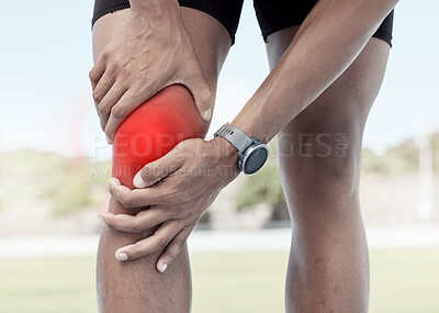 Buy stock photo Closeup of one sportsman holding his sore knee in glowing red. Uncomfortable athlete suffering from a painful leg injury and inflamed muscles during workout. Muscle strain due to overexertion