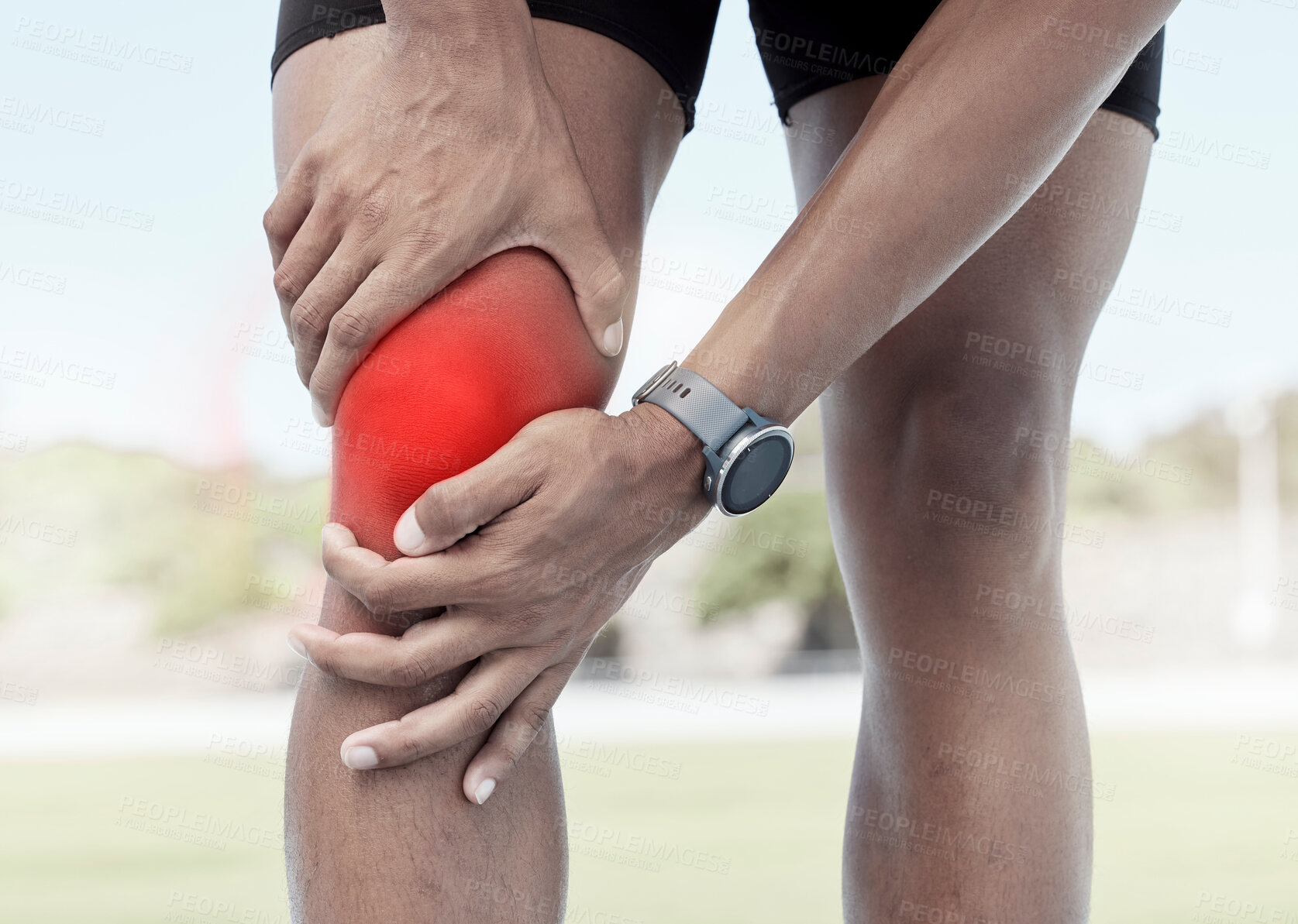 Buy stock photo Closeup of one sportsman holding his sore knee in glowing red. Uncomfortable athlete suffering from a painful leg injury and inflamed muscles during workout. Muscle strain due to overexertion