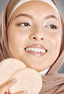 Buy stock photo Young Arabic girl in hijaab with a smile. A beautiful middle-eastern Muslim lady wearing the abaya. 
Close up of an Arabian woman with makeup puff in a strict cultural outfit and elegant appearance.