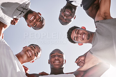 Buy stock photo Portrait of sporty men from below joining in huddle for support and unity. Group of cheerful friends and motivated athletes collaborating together in solidarity as a happy team and diverse community