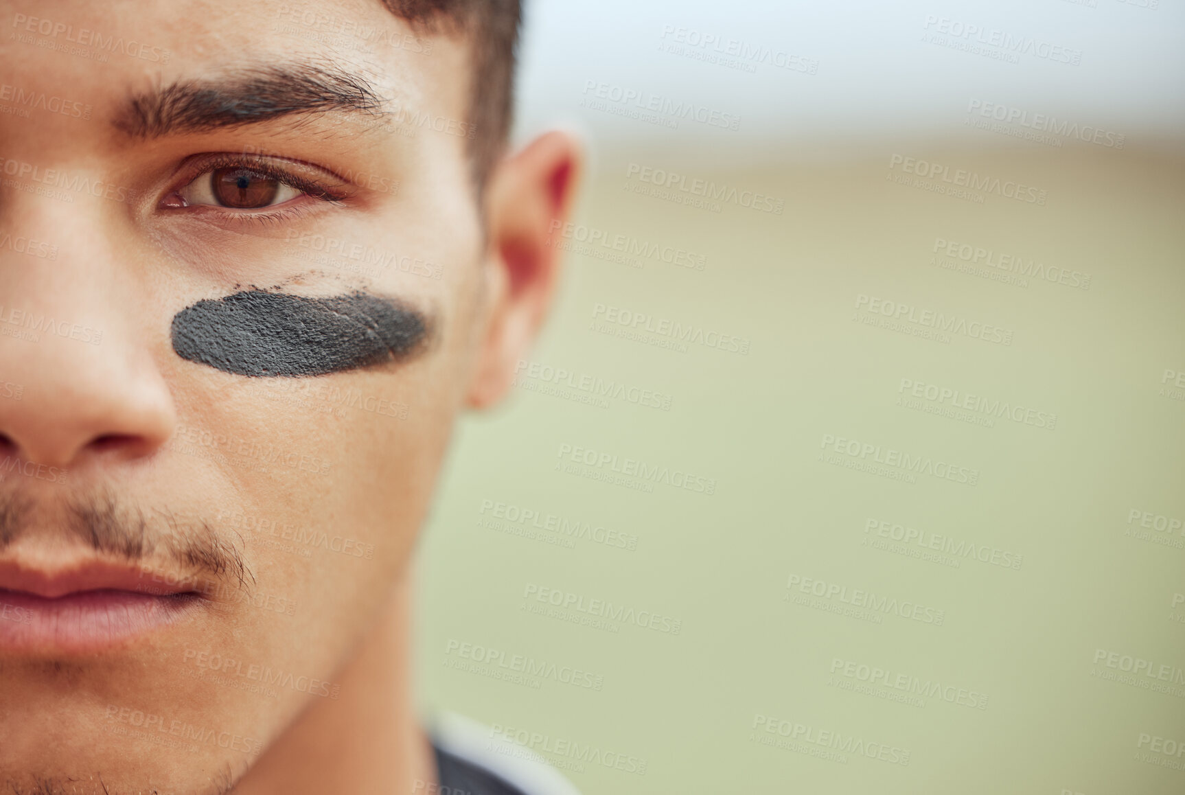 Buy stock photo Portrait of a young male baseball player standing on a field with black paint markings on his face. Focused skilled sportsman, determined and motivated to have a competitive sporting game outside